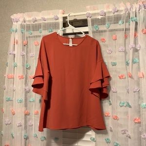 Super cute casual shirt. Size large. Burnt orange color